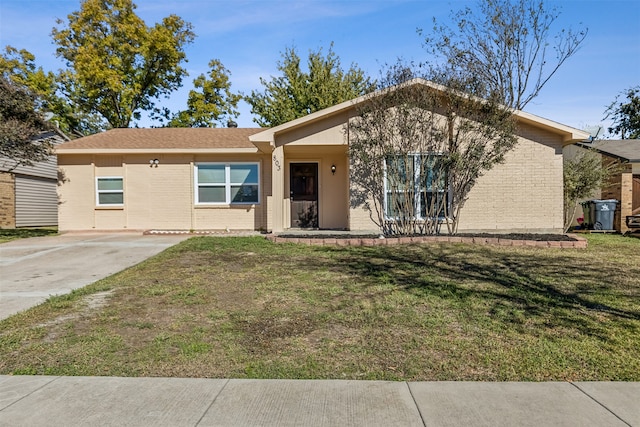 ranch-style home with a front lawn