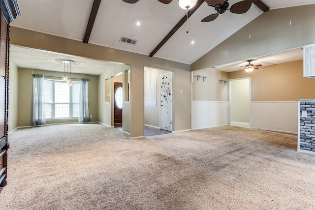 unfurnished living room with carpet floors, lofted ceiling with beams, and ceiling fan