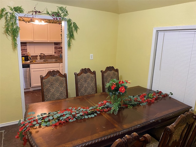 dining space featuring hardwood / wood-style flooring and sink