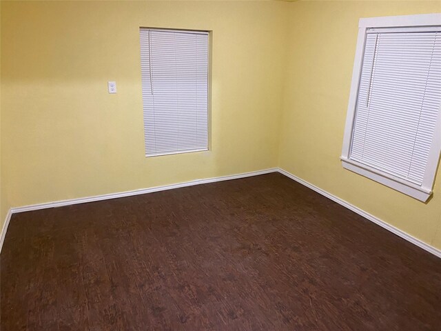 spare room featuring hardwood / wood-style flooring