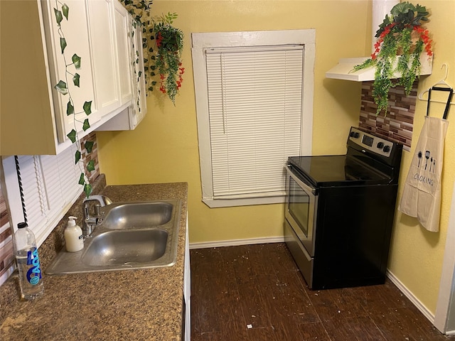 kitchen with dark hardwood / wood-style flooring, ventilation hood, stainless steel electric range oven, sink, and white cabinetry