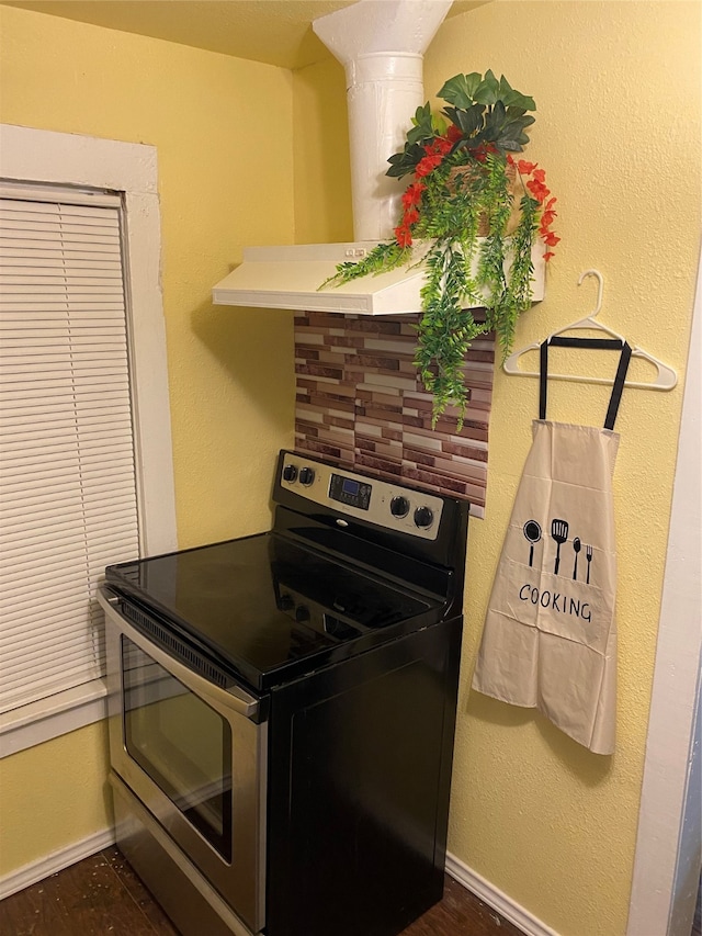 kitchen featuring backsplash and stainless steel electric range