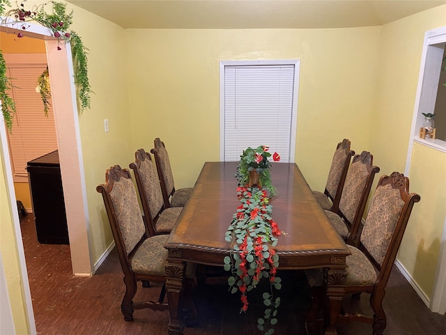 dining area with dark hardwood / wood-style floors