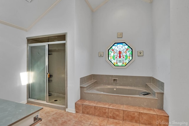 bathroom with tile patterned flooring, separate shower and tub, ornamental molding, and high vaulted ceiling