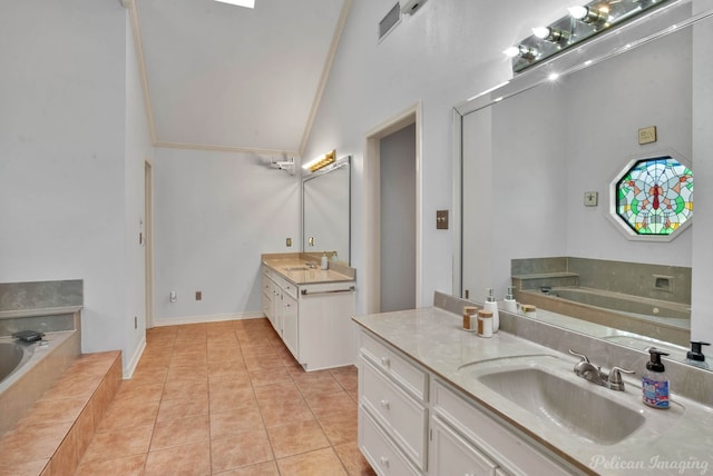 bathroom with vanity, tile patterned floors, vaulted ceiling, a relaxing tiled tub, and ornamental molding