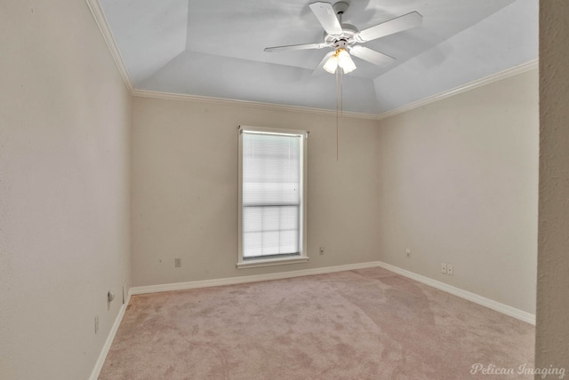 empty room featuring light carpet, crown molding, and lofted ceiling