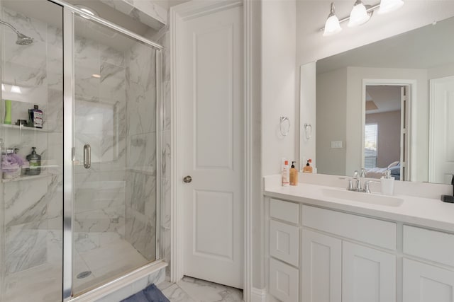 bathroom with vanity and an enclosed shower