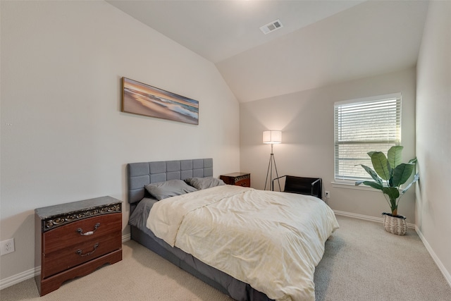 carpeted bedroom featuring lofted ceiling