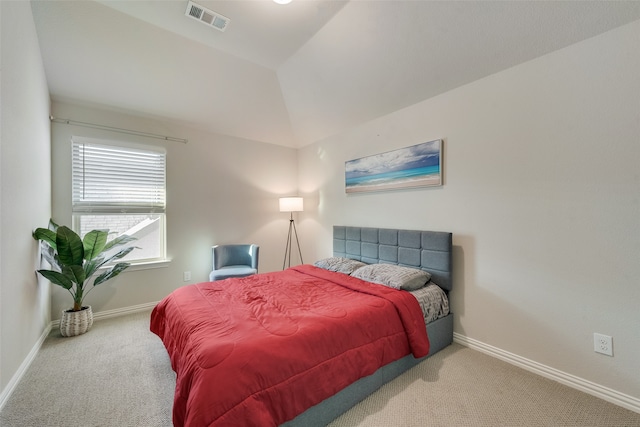 carpeted bedroom featuring vaulted ceiling