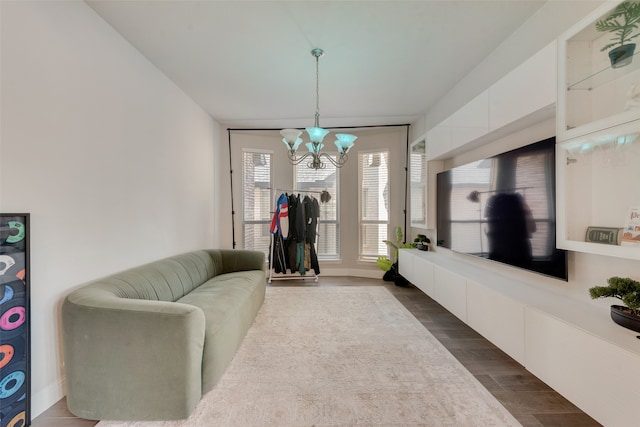 living room featuring hardwood / wood-style flooring and a notable chandelier