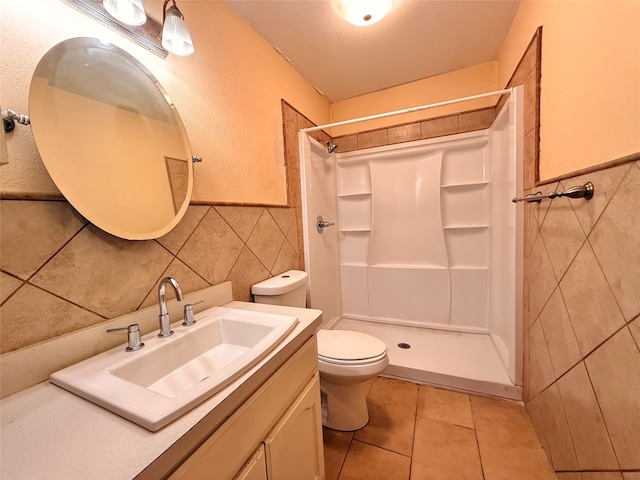 bathroom with walk in shower, tile patterned flooring, toilet, and tile walls