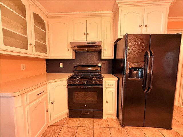 kitchen with tasteful backsplash, crown molding, light tile patterned flooring, and black appliances