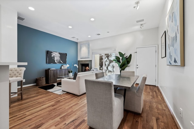 dining space featuring wood-type flooring