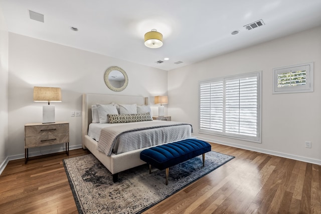 bedroom featuring dark hardwood / wood-style flooring