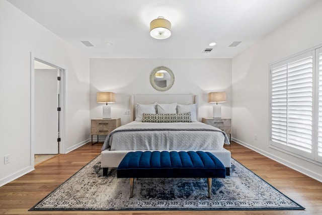 bedroom with wood-type flooring