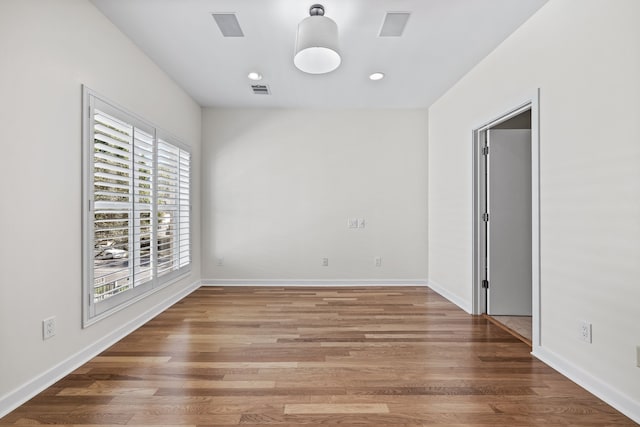 spare room featuring hardwood / wood-style flooring