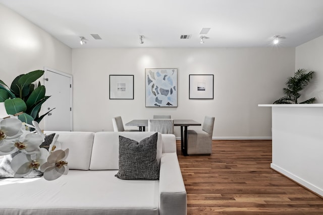 living room featuring dark hardwood / wood-style flooring