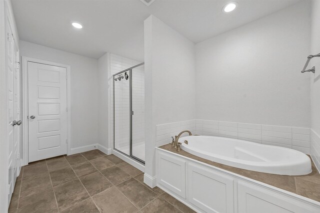 bathroom featuring shower with separate bathtub and tile patterned floors