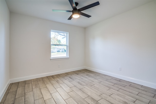 empty room featuring light hardwood / wood-style flooring and ceiling fan