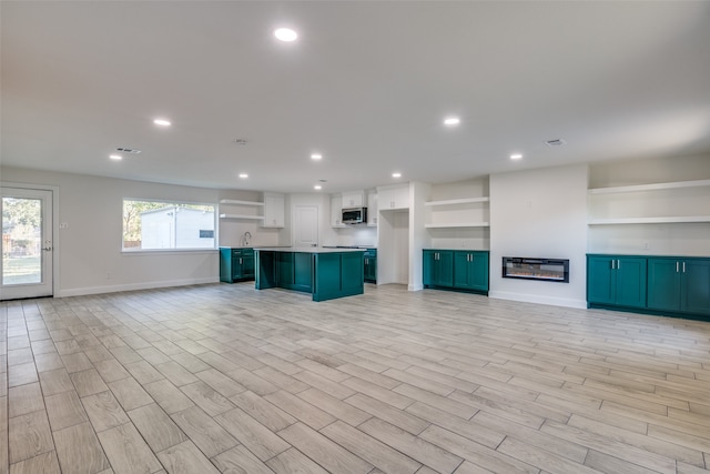 unfurnished living room with light hardwood / wood-style floors