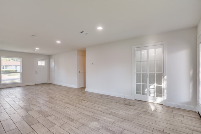 spare room featuring light wood-type flooring