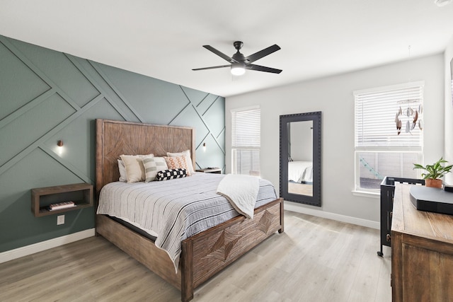 bedroom featuring ceiling fan and light wood-type flooring