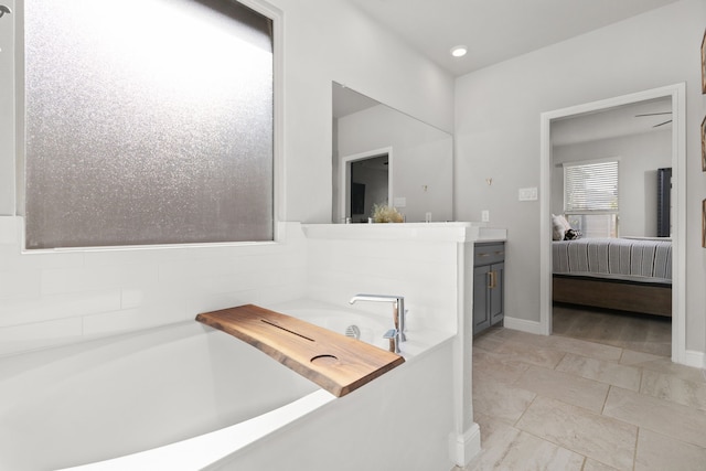 bathroom featuring vanity and a bathtub