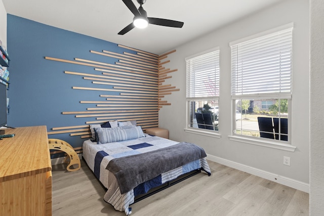 bedroom featuring ceiling fan and wood-type flooring