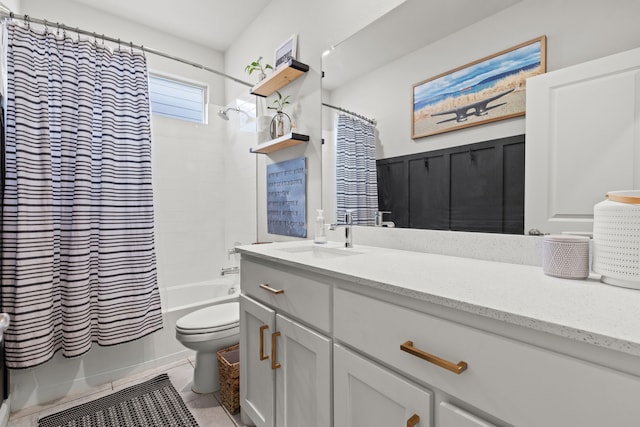 full bathroom featuring toilet, shower / bath combo with shower curtain, vanity, and tile patterned flooring