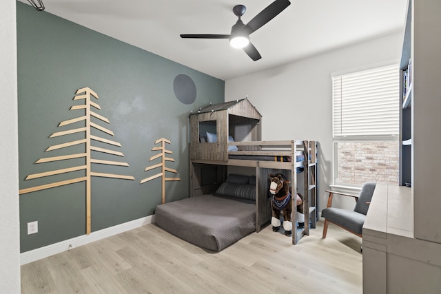 bedroom with light hardwood / wood-style floors, multiple windows, and ceiling fan