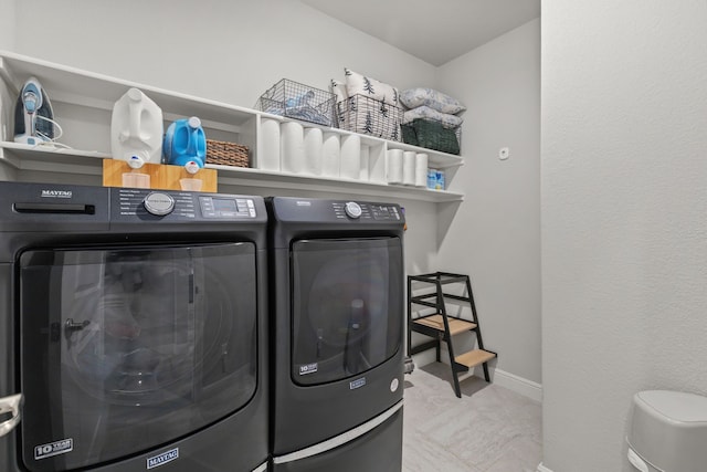 laundry room with independent washer and dryer