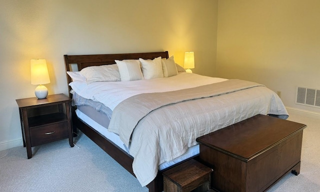 bedroom featuring light colored carpet