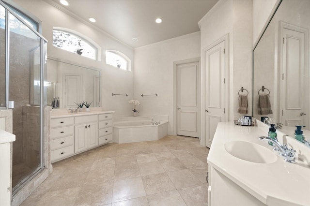 bathroom with a healthy amount of sunlight, separate shower and tub, ornamental molding, and vanity