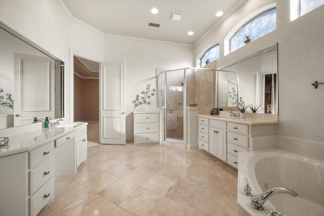 bathroom with vanity, tile patterned floors, crown molding, and plus walk in shower