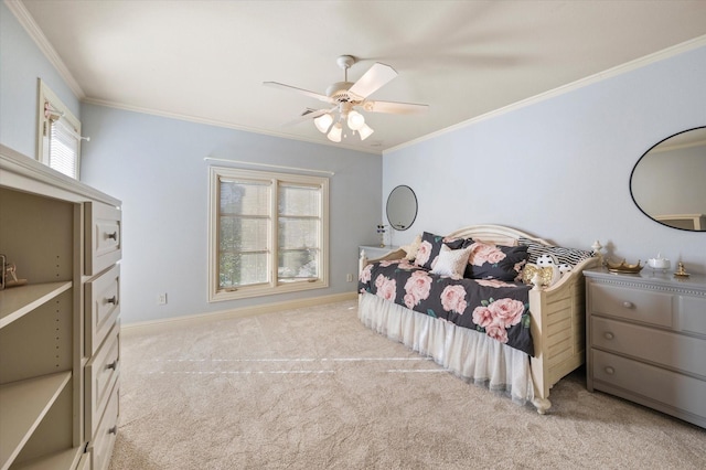 carpeted bedroom with ceiling fan and crown molding