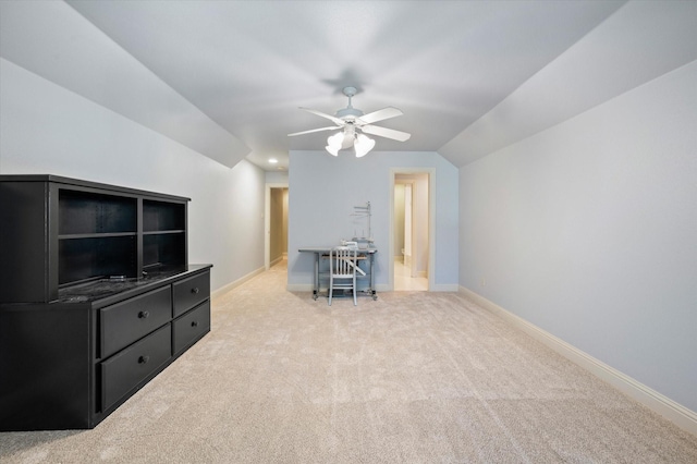 interior space with lofted ceiling, ceiling fan, and light colored carpet