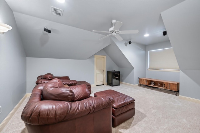 cinema featuring light carpet, ceiling fan, and vaulted ceiling