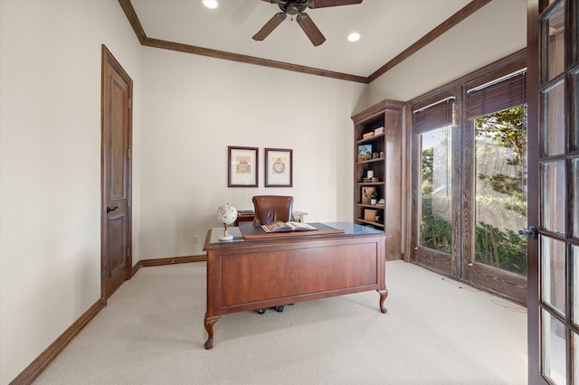 home office with light carpet, ceiling fan, and ornamental molding