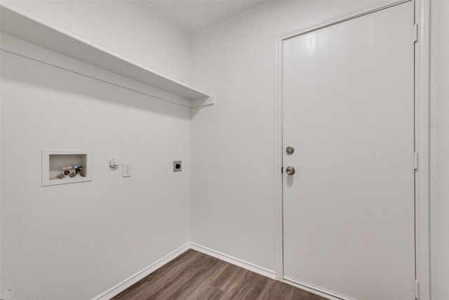 washroom featuring dark hardwood / wood-style floors, hookup for a gas dryer, hookup for a washing machine, and electric dryer hookup