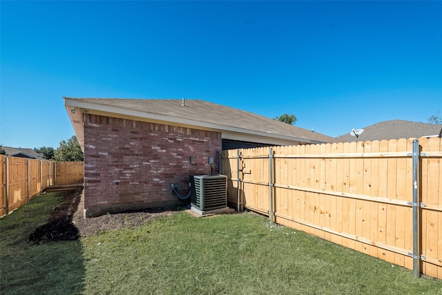 view of yard with central AC