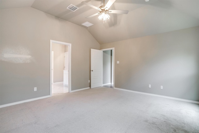 unfurnished bedroom with ceiling fan, light carpet, and lofted ceiling