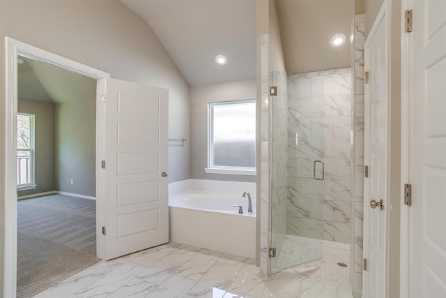 bathroom with lofted ceiling and independent shower and bath