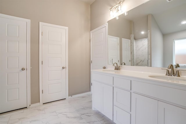 bathroom featuring vanity and tiled shower