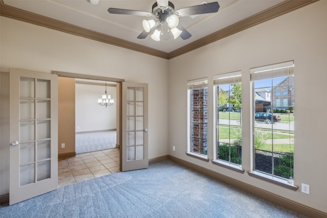 spare room with light carpet, french doors, ceiling fan, and crown molding