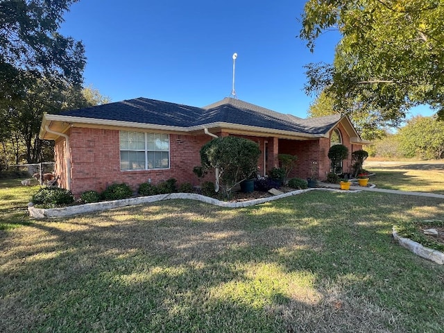 ranch-style house featuring a front lawn