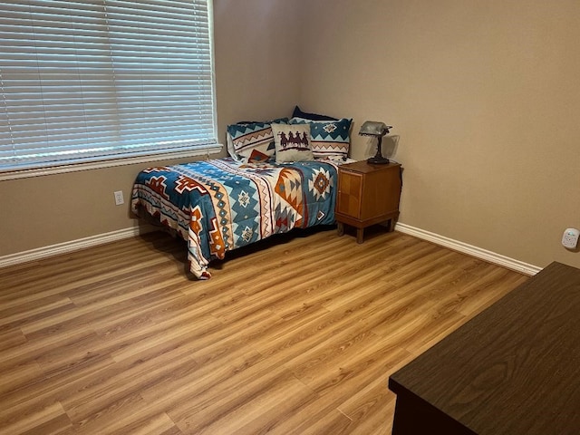 bedroom featuring hardwood / wood-style flooring