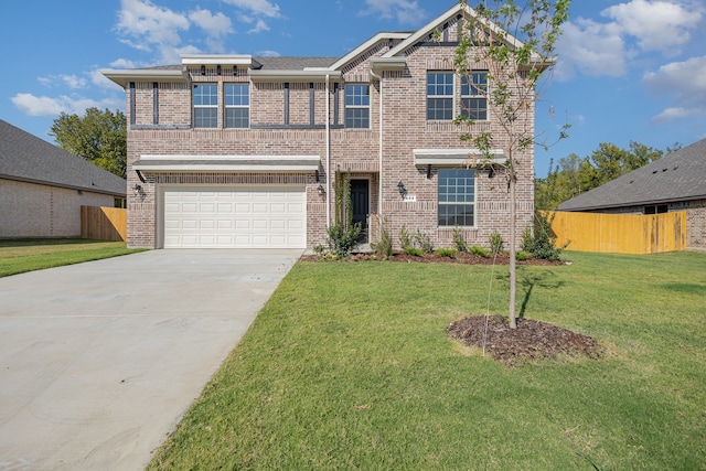 view of front of home featuring a garage and a front yard