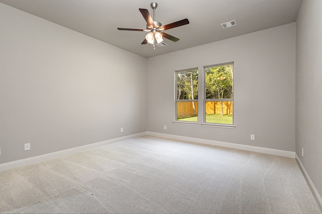 carpeted empty room with ceiling fan