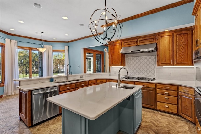 kitchen featuring a center island with sink, sink, stainless steel appliances, and light parquet flooring