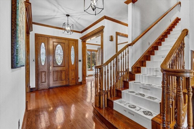 362 Woodland Hills Dr, Sherman, TX 75092 - entrance foyer featuring a chandelier, wood finished floors, stairs, crown molding, and baseboards